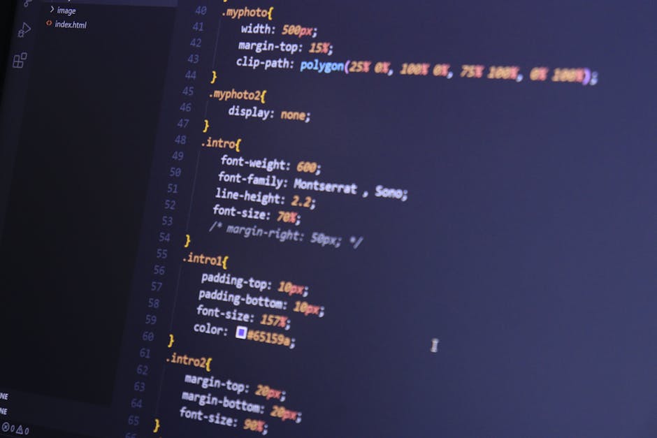 In the image, a computer screen displays a close-up view of programming code written in CSS with various styles, including font weights, font family, line height, and padding, shown in multiple colors